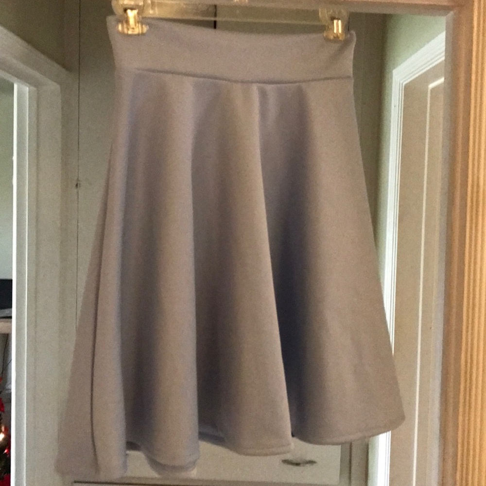 Kicky light blue A-frame new skirt, size L.